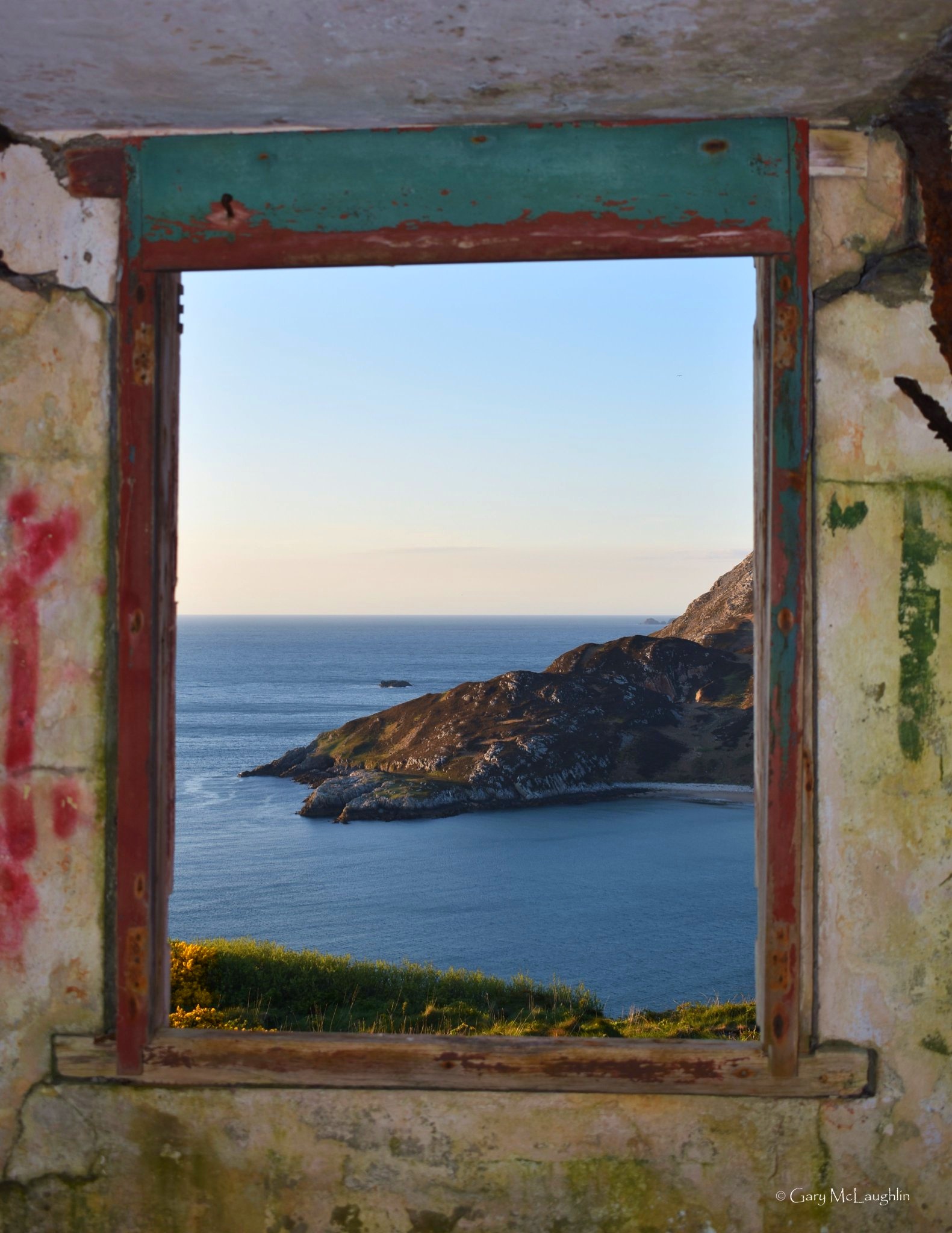 Dunree Bay framed through a window