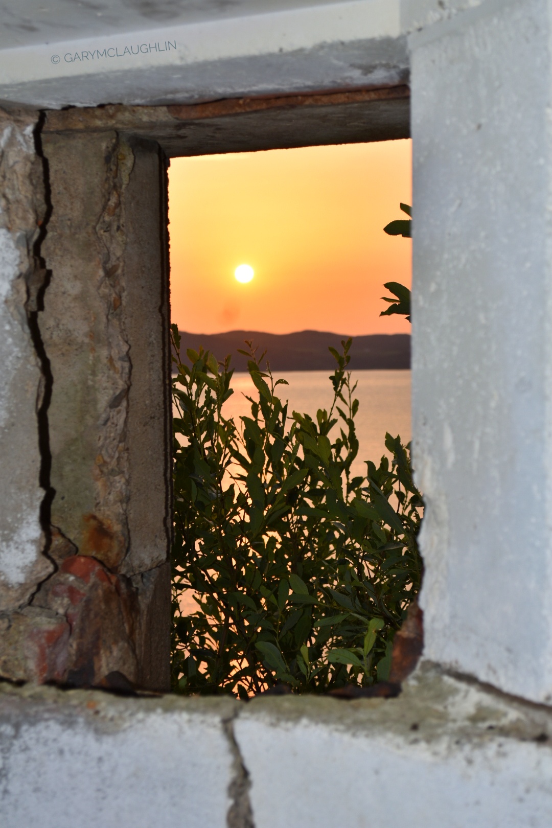 Dunree sunset framed through an opening